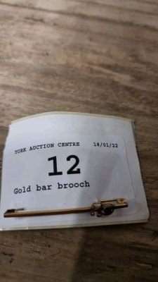 Gold bar brooch