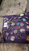Cushion of brooches