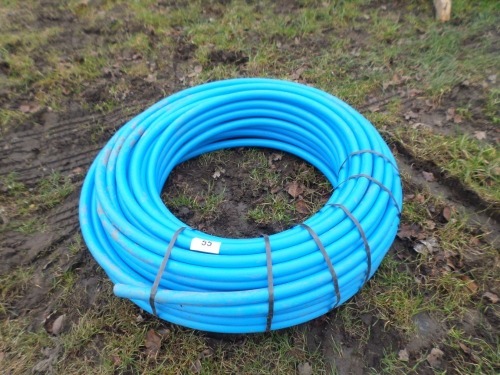 Large roll of blue alkathene water pipe