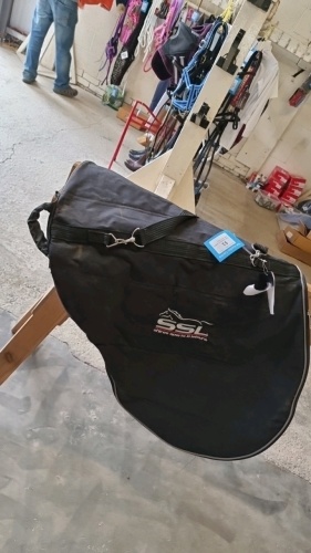 Black waterproof saddle cover with strap