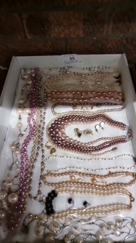 Tray of pearl type costume jewellery, some coloured