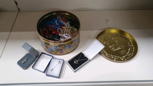 Tin of costume jewellery