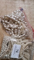 2 Bags of costume jewellery pearls etc