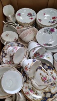2 boxes of tea and dinnerware