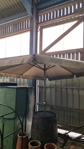 Barrel table and large umbrella