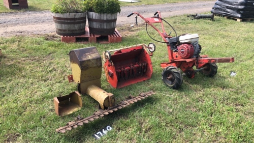Petrol rotavator with Allen scythe attachment