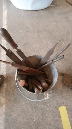 Bucket of files and chisels