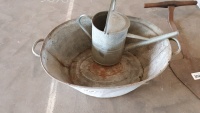 Galvanised bathtub and watering can