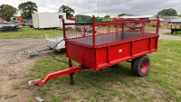 Compact tractor tipping trailer, caged side