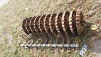 11 x Guttler roller rings on shaft with scraper bars