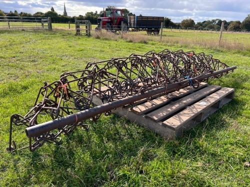 Trailed chain harrows