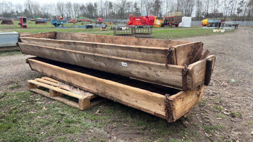 3 wooden cattle troughs with chains