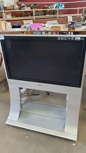 Panasonic 37" TV and remote on stand