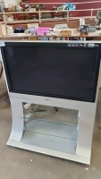 Panasonic 37" TV and remote on stand
