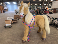 Electronic Butterscotch Pony, has touch, light and pressure sensors, moves head and wiggles ears, sit on and pretend to ride