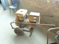 Robin EY44 petrol engine with Tooley 4 KVA 240 ac 1 ph 16 ap generator pack with twin socket outlet on wheels and stand