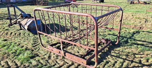 Round bale cradle feeder and another