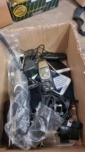 Box of assorted mobile phones used