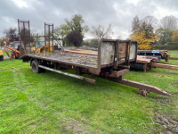 Tractor tail single axle trailer with ramps