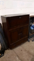Dark wood Ercol bureau with drop down desk and drawer, on wheels