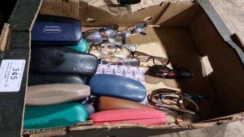 Various sunglasses and reading glasses