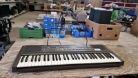 Casio Casiotone CT-620 keyboard player with music stand and power adaptor.