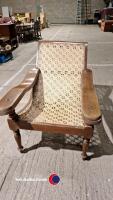 Original vintage Indian veranda chair, teak with rattan seat. Bought in Delhi and imported back to the UK in the 90's. In good condition though in need of a little maintenance on one of the arms. - 2
