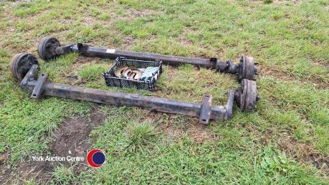 Pair of trailer axles with new shoes and cylinders