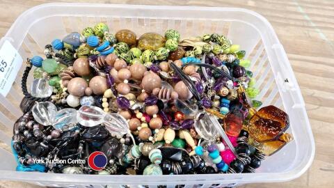 Large storage basket of beaed jewellery