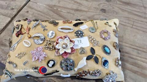 Cushion full of brooches