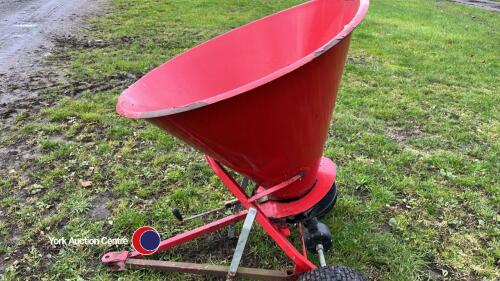 Towed ground drive tillage spreader for compact