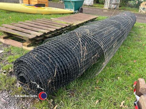 Roll of black mesh wind break