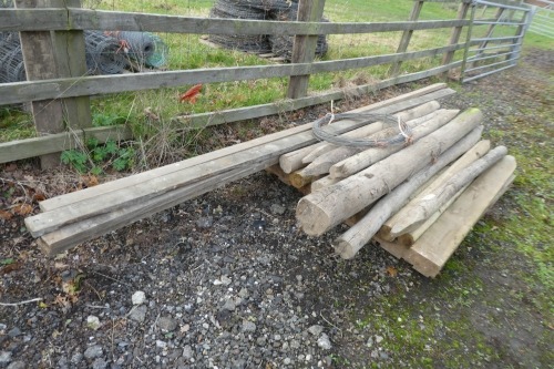 Various fence posts, stakes and rails