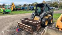 New Holland skidsteer c/w bale spike and muck scraper - Key in office - 2