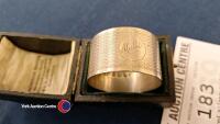 A cased silver napkin ring from 1910 - 2