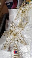 Quantity of light up star Christmas tree toppers - 2