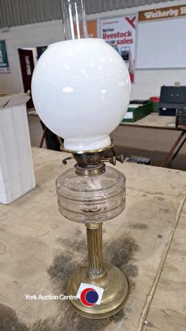 Tall brass paraffin lamp with glass shade