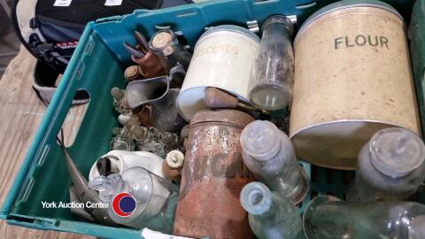 Box of vintage bottles and tins