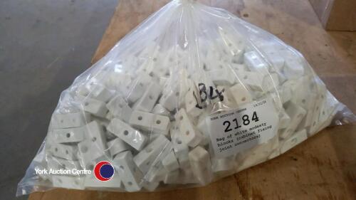 Bag of white modesty blocks (cabinet fixing joint connectors)