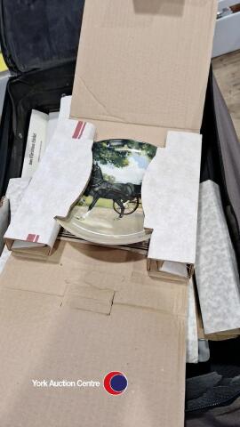 Quantity of collectable boxed plates with certificates in suitcase