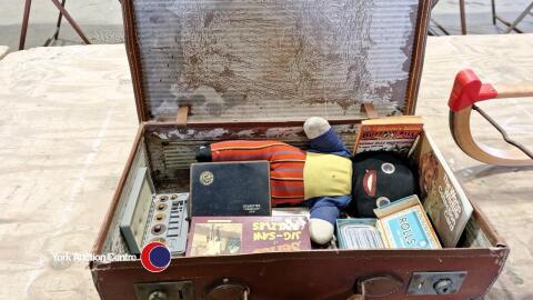 Small vintage case with collectables inside