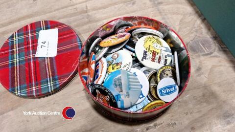 Tin of badges