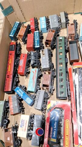 Box of model railway rolling stock including Hornby