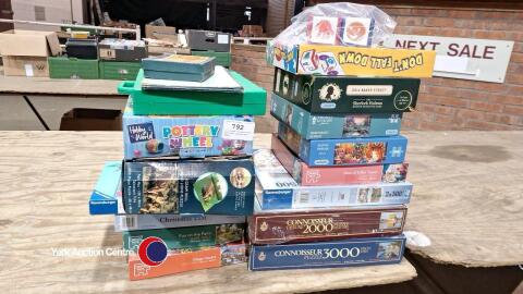 2 x boxes of mixed new and used jigsaws and games