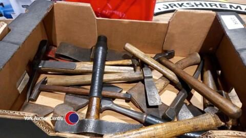 Box of vintage hammers and hatchets