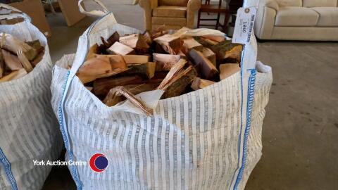 Hardwood logs in vented bulk bag.