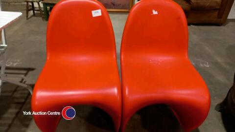 2 x red Vitra stacking chairs