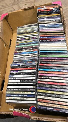 Box of rock and jazz CDs