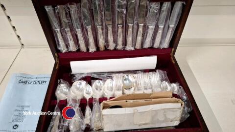 Presentation box of silver plate cutlery in wooden box