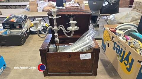 Wooden box containing candlestick holder and candles